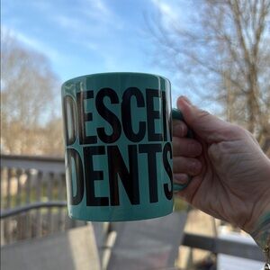 Turquoise Mug with Bold Black 'DESCENDENTS' Graphic